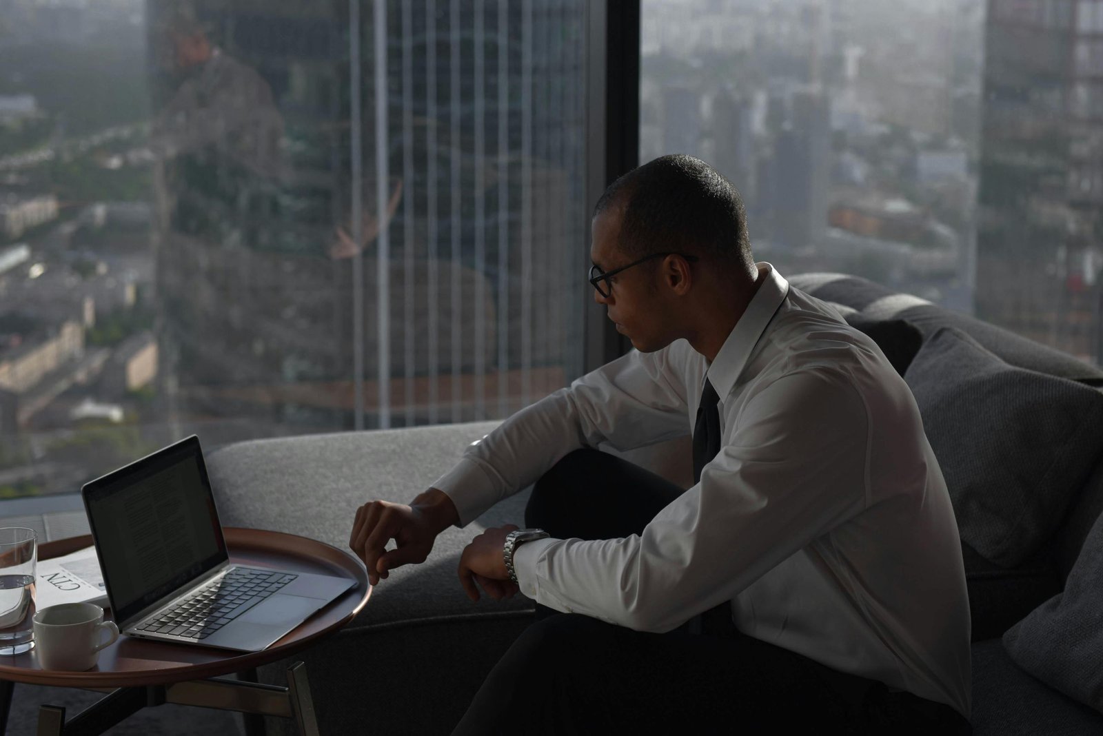 A man sitting in MHAFs office working on a laptop